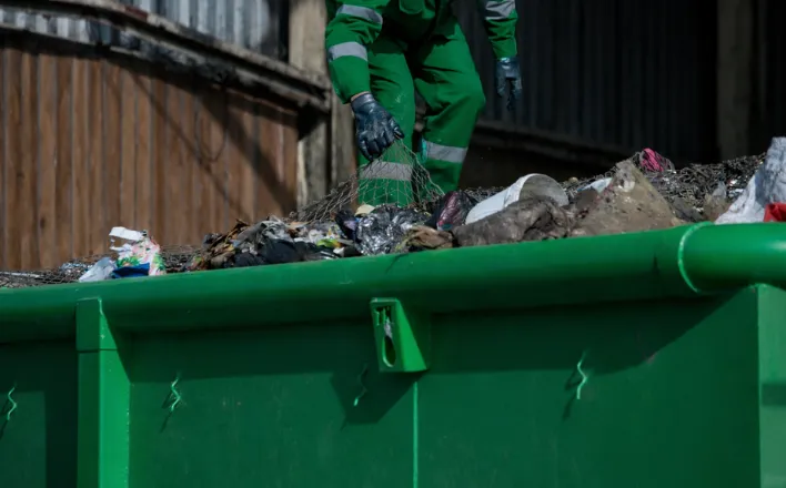 Dump Pro Dallas crew safely handling debris
