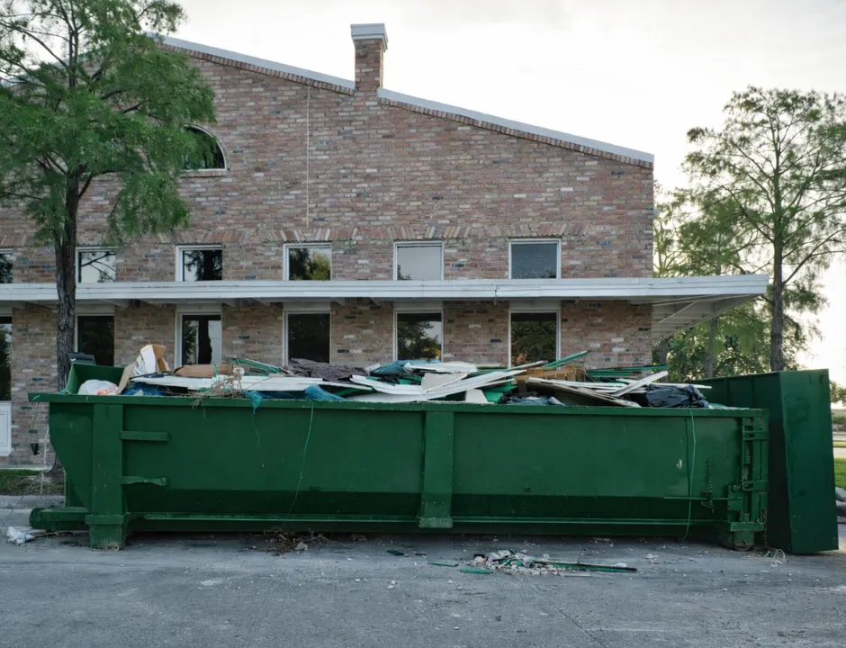 Commercial dumpster rental used for construction and renovation debris at a business site