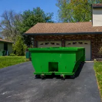 Residential dumpster rental delivered to a driveway in Dallas