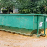 Residential roll-off dumpster placed at a home project site in Dallas